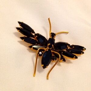 Black and gold brooch